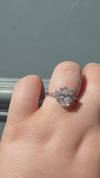 Oval cut with a trefoil of Round and marquise diamonds